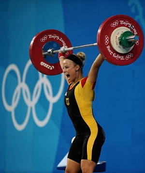 Topless girls weightlifting